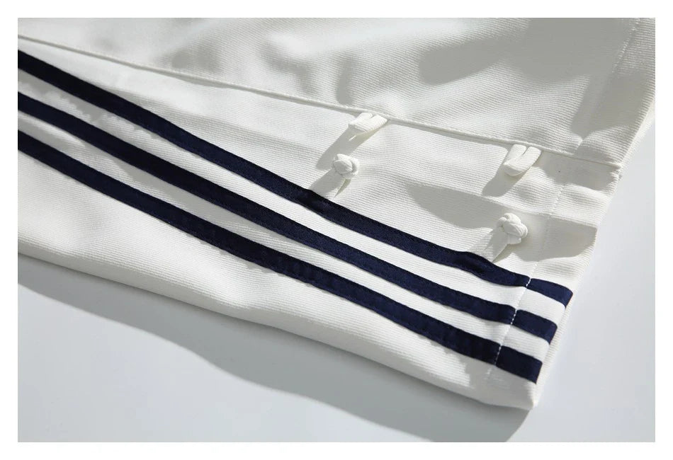 Stylish striped sports trousers in a relaxed, mid-waist design for versatile leisure and athletic wear