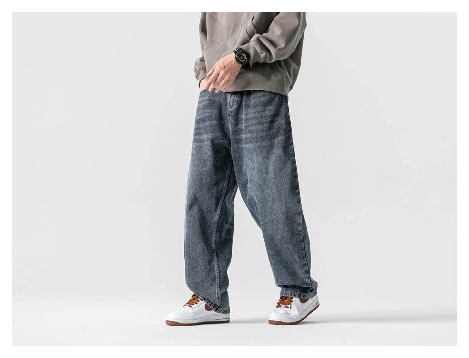 A pair of stylish retro-inspired Japanese jeans in black and grey, featuring a mid-rise waist and straight leg silhouette for a flattering, comfortable fit.