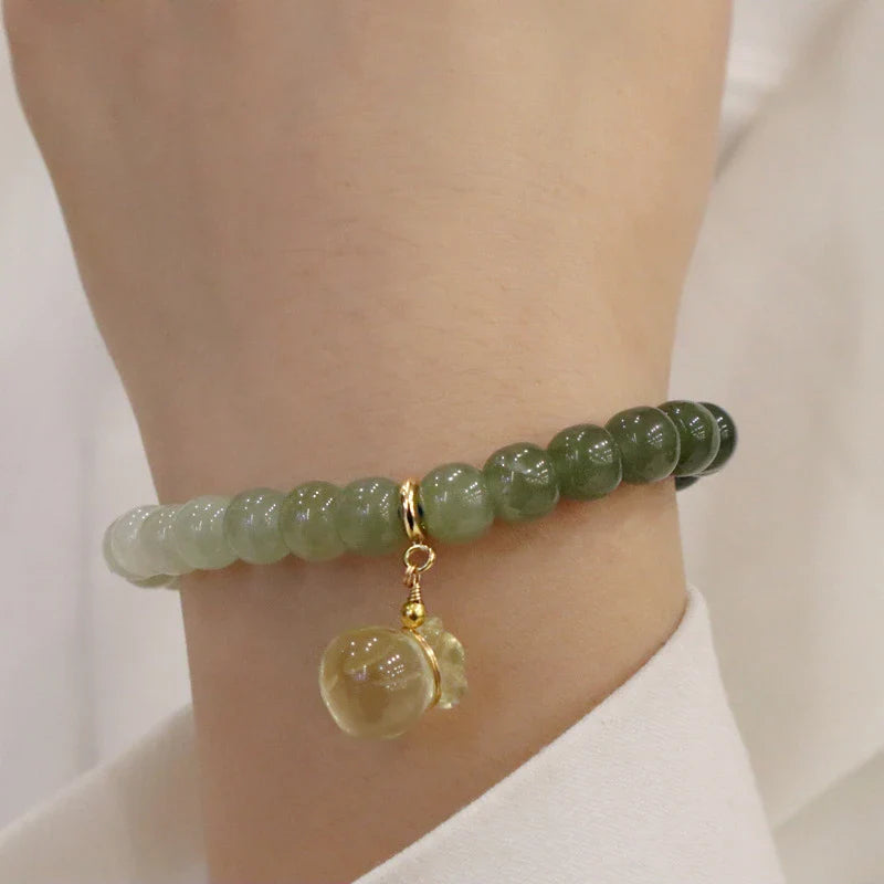 Elegant Hetian jade barrel bead bracelet with gradual colour transition, handcrafted with premium materials for a sophisticated style.