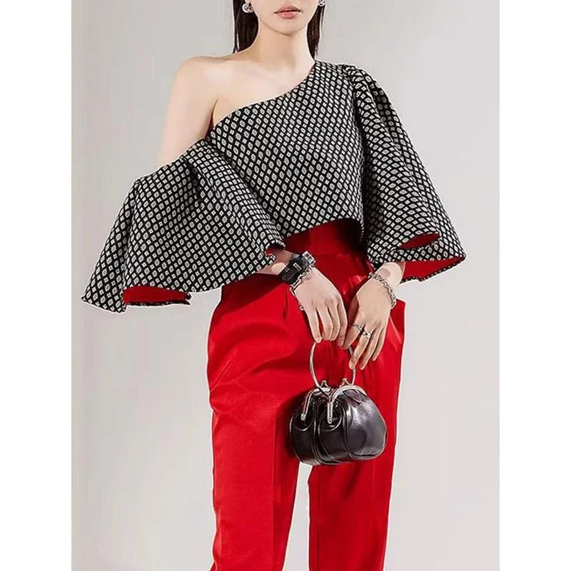 Elegant off-shoulder blouse with butterfly sleeves and vibrant printed pattern