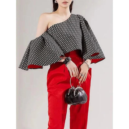 Elegant off-shoulder blouse with butterfly sleeves and vibrant printed pattern
