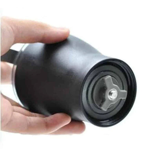 Stylish powder coffee grinder in black and red, with a manual grinding mechanism for consistent and freshly ground coffee.