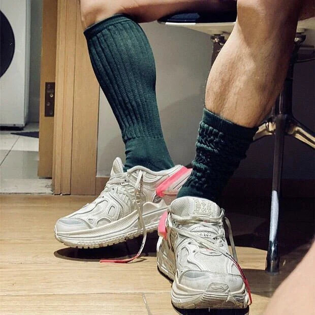 Premium men's breathable terry socks in various solid colours, offering superior moisture-wicking and comfort