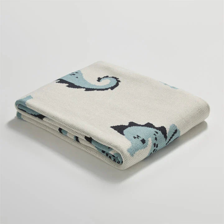 Soft and cosy 100% cotton blanket with a charming sea horse design, perfect for relaxation at home or on the go.