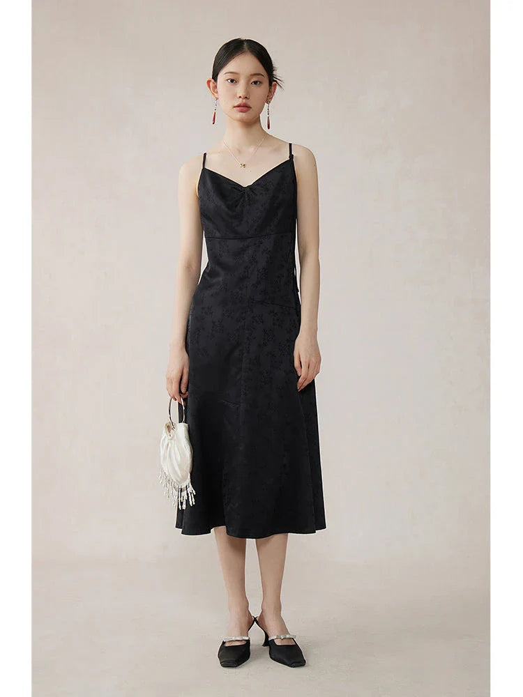 Elegant mint green midi dress with spaghetti straps, featuring a flattering slim fit and beautiful embroidery detailing