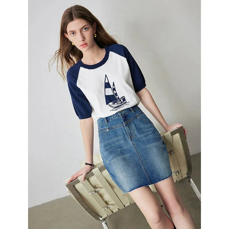 Sophisticated lyocell denim mini skirt with classic A-line silhouette and functional pockets for the discerning British woman