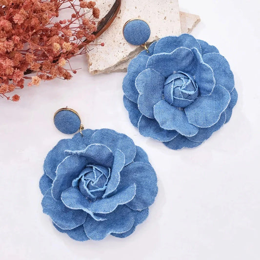 Exquisite denim drop earrings with charming accents, perfect for elevating British fashion and style