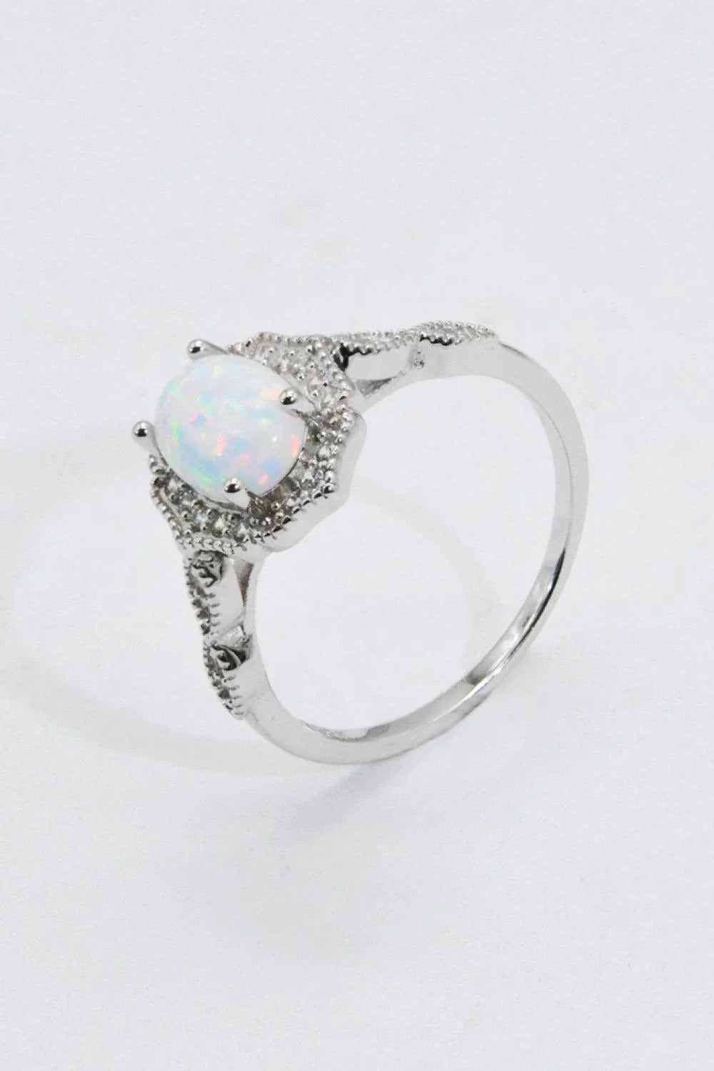 A stunning platinum-plated opal ring made from 925 sterling silver, featuring a modern and minimalist design