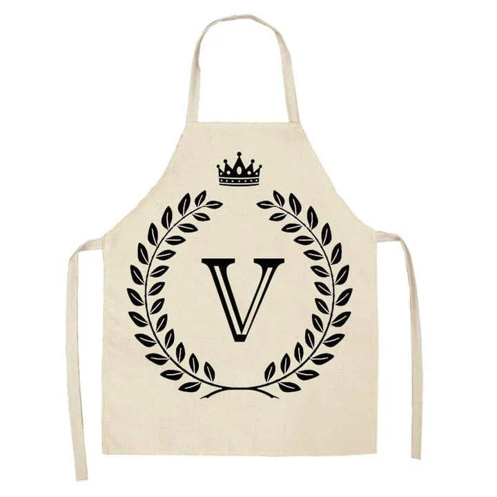 A high-quality kitchen apron featuring a charming crown and letter print design in a premium cotton and linen blend fabric.