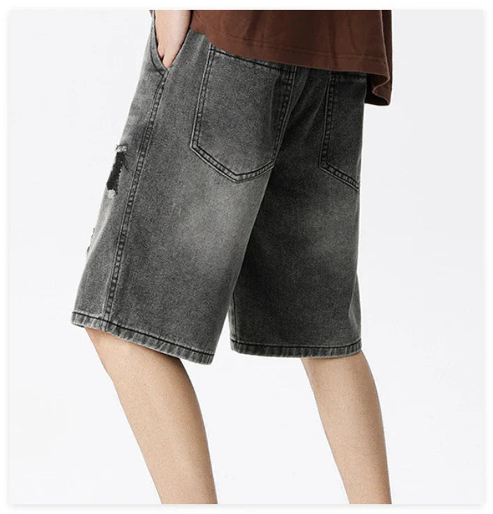 Premium British-crafted vintage-inspired ripped denim shorts for men with a straight-leg silhouette and authentic distressed details