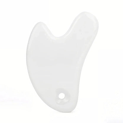 Ceramic Gua Sha facial massager in blue, pink, and white colours, designed to improve circulation and promote lymphatic drainage for radiant, youthful skin.