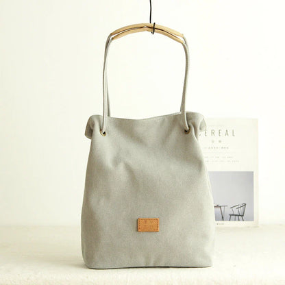 Premium canvas lattice shoulder bag in various colours, featuring a spacious design with secure zipper closure and adjustable strap for comfortable everyday carry