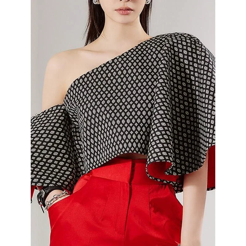 Elegant off-shoulder blouse with butterfly sleeves and vibrant printed pattern
