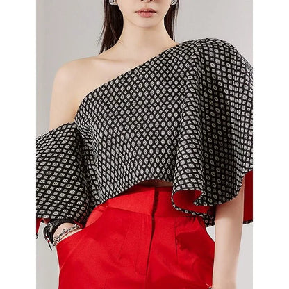 Elegant off-shoulder blouse with butterfly sleeves and vibrant printed pattern