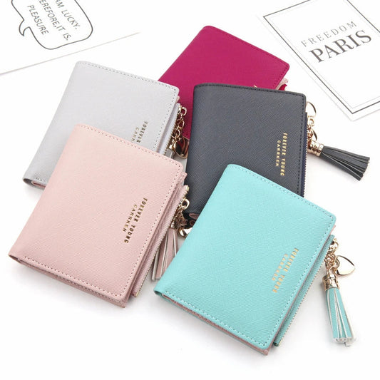 Premium genuine leather women's coin purse with zipper closure, available in black, brown, and navy colours, and multiple sizes.