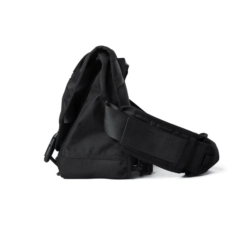 Premium casual messenger bag made with Oxford spinning material, featuring a structured yet soft exterior, ample storage space, and a water-resistant design for the modern British gentleman.