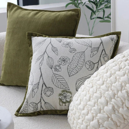 Luxurious cream and green jacquard cushion cover with a unique pattern, measuring 45 x 45 cm for a generous size and impactful presence.