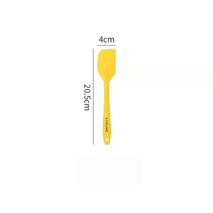 A set of two high-quality silicone spatulas in brown and yellow colours, designed for versatile cooking and baking tasks.