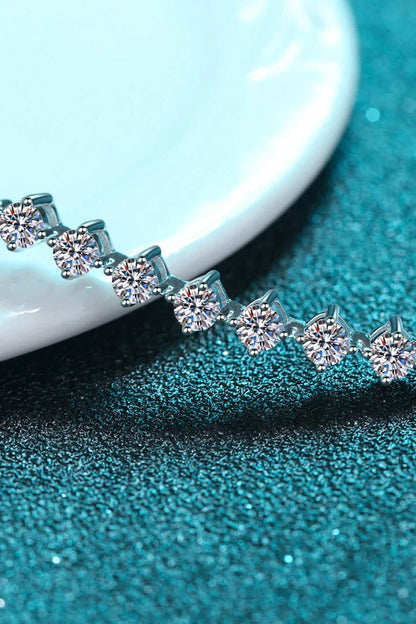 Elegant moissanite and sterling silver bracelet with a rhodium plated finish, designed for sophisticated style.
