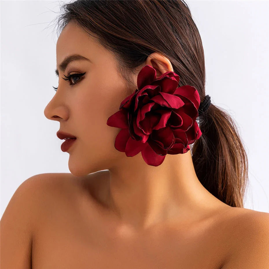 Exquisite fluffy fabric flower stud earrings in a black metal colour, featuring oversized fabric blooms for a unique and elegant design.