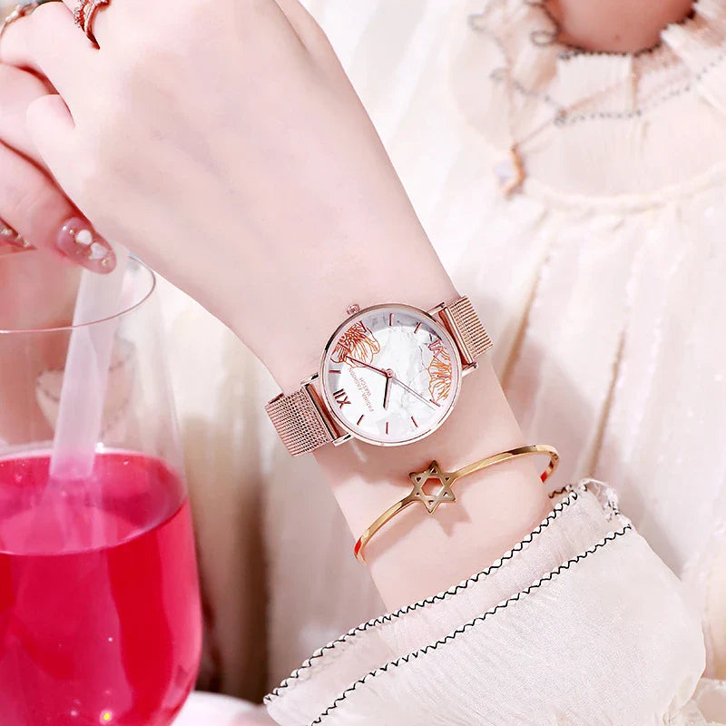 Elegant French ladies' fashion watch with stainless steel case and leather strap, featuring a white dial and classic design