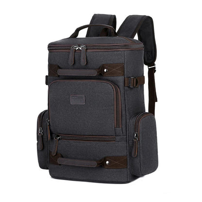 A classic messenger bag made of durable canvas with genuine leather trim, offering style and function for the modern British gentleman