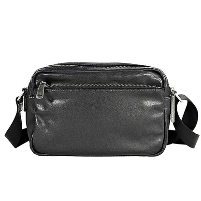 A premium British leather shoulder bag with a sleek, minimalist design and adjustable strap