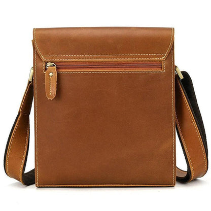 Premium leather crossbody bag with flap closure, vertical square shape, and multiple interior compartments