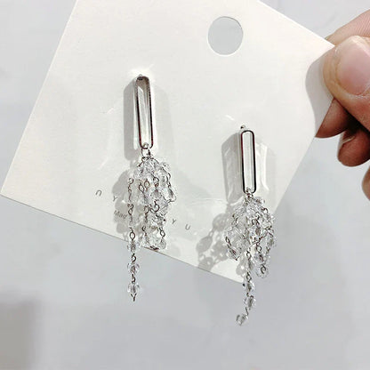 Elegant crystal grape cluster earrings with a cascading, geometric design in a premium gold finish