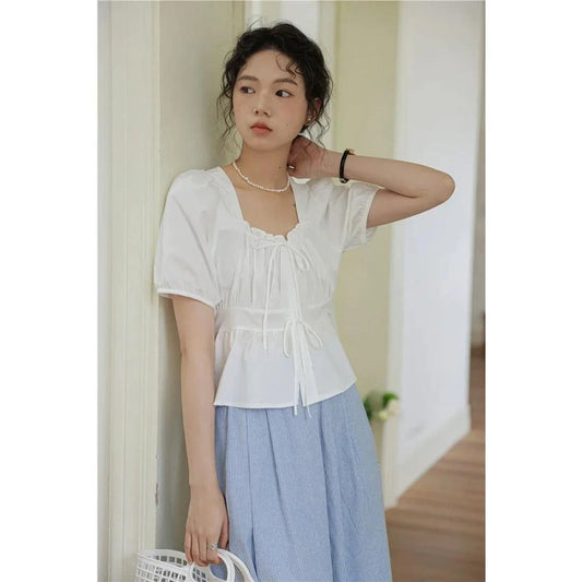 Elegant vintage square neck puff sleeve blouse in white with lace-up detail and puff sleeves