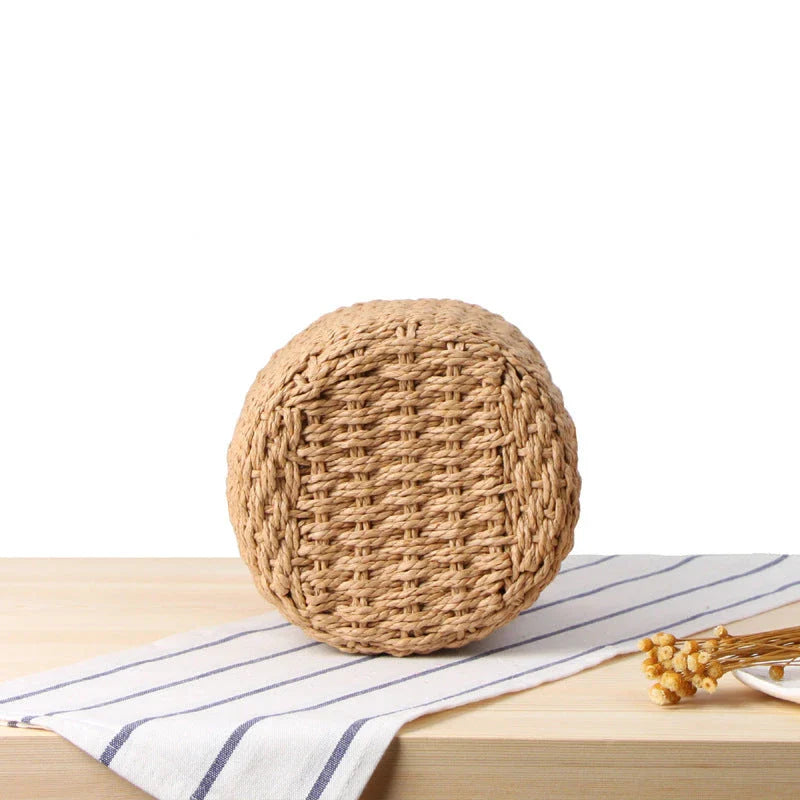 Elegant hand-crafted straw bucket bag in camel or beige, featuring a compact and lightweight design for versatile British summer style