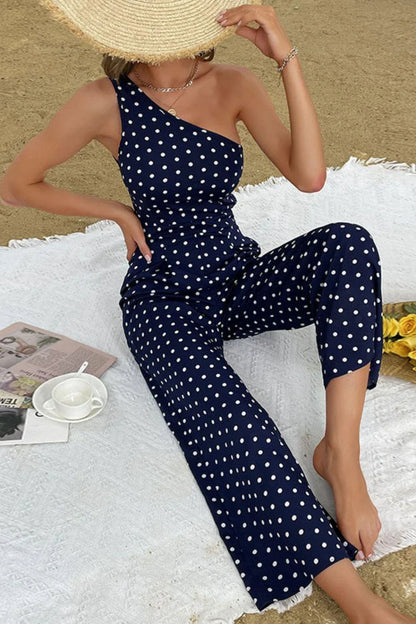 A stylish one-shoulder polka dot jumpsuit with a flattering, figure-hugging silhouette