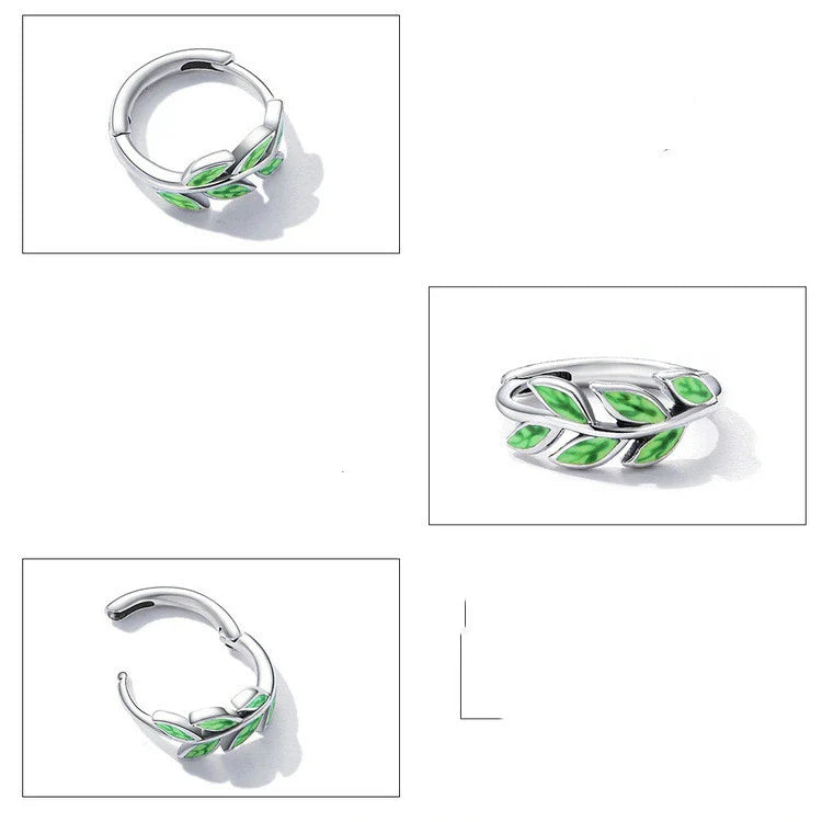Elegant silver earrings with a fern-inspired design and sparkling green zircon centerpiece