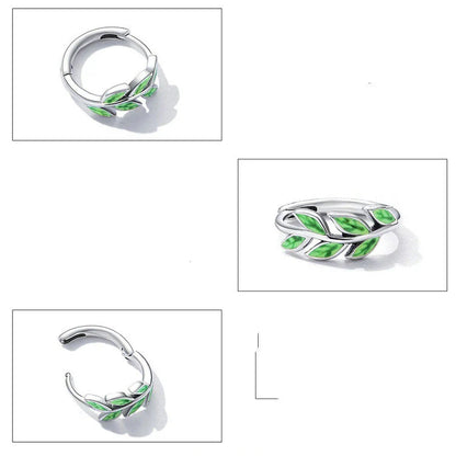 Elegant silver earrings with a fern-inspired design and sparkling green zircon centerpiece