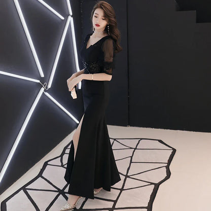 Elegant black evening dress with middle-length sleeves, perfect for formal occasions in the UK