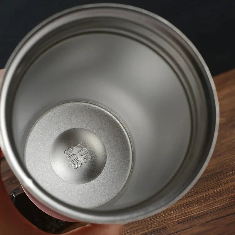 Stylish and durable stainless steel thermos mug with double-wall vacuum insulation, keeping drinks hot or cold for hours on end.