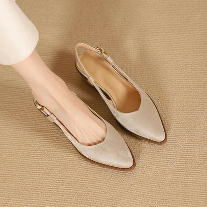 Elegant slingback leather pumps with a stylish mule design, secure buckle closure, and 4cm square heel