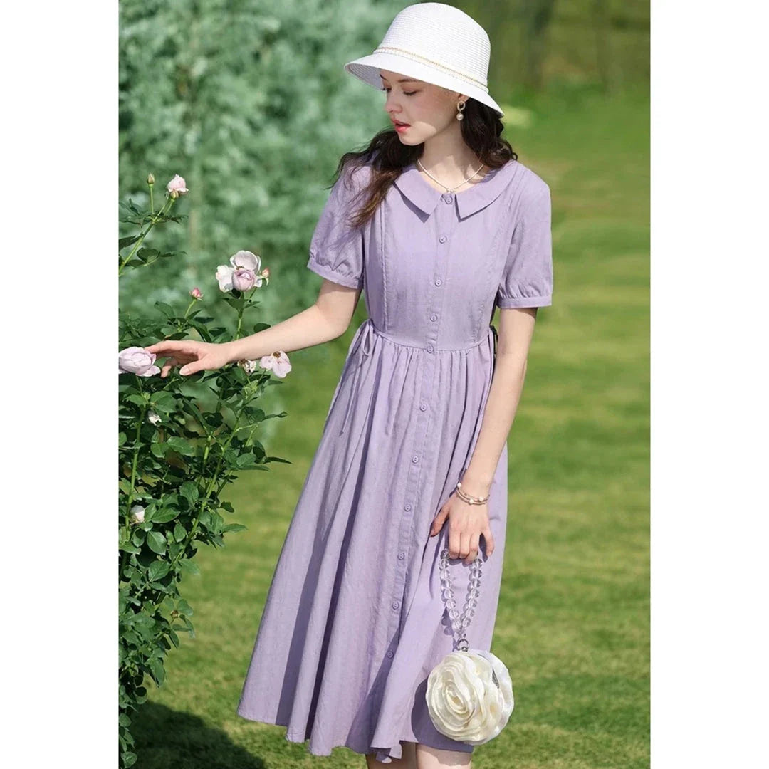 Sophisticated French-inspired short sleeve summer dress with puff sleeves, turn-down collar, and lace-up detailing