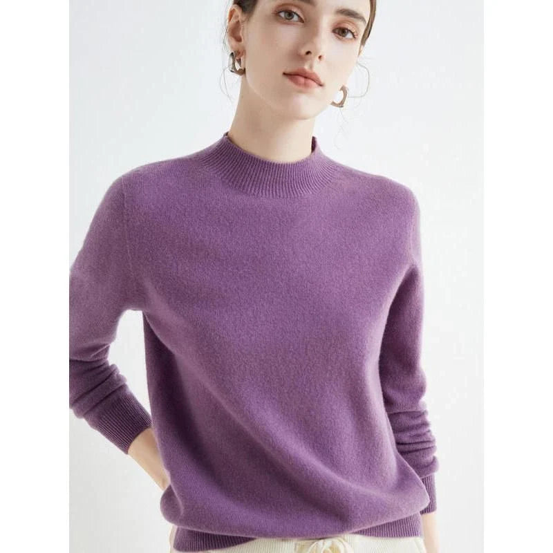 A woman wearing a luxurious Merino wool mock-neck jumper in a stylish autumnal outfit