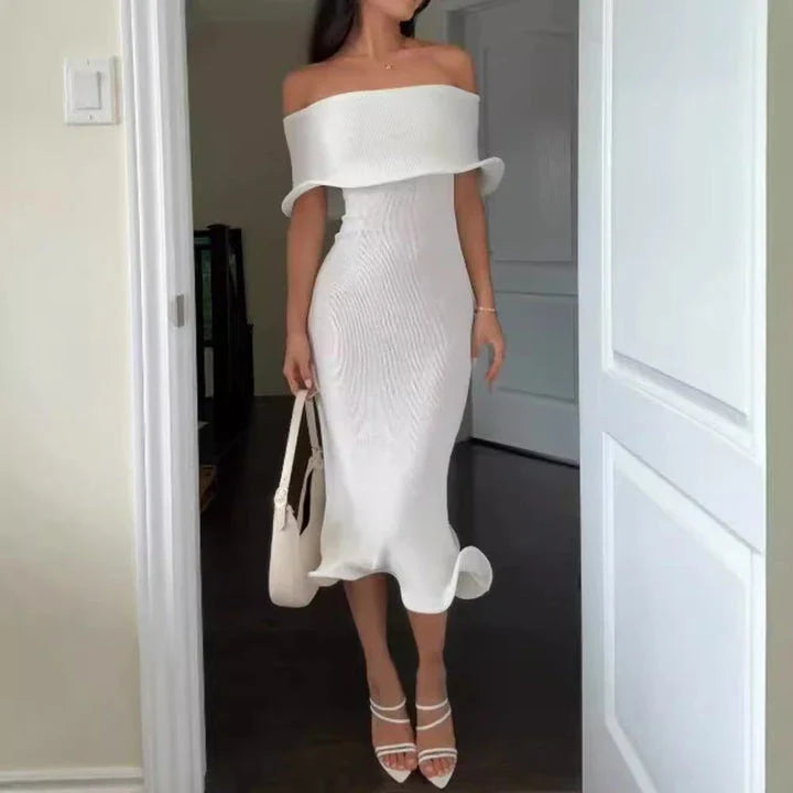 Chic white sleeveless dress with slim-fit silhouette, perfect for stylish occasions in the UK