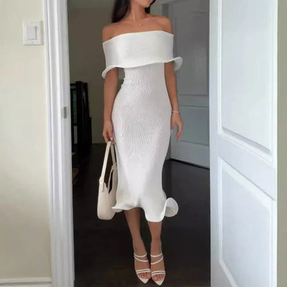 Chic white sleeveless dress with slim-fit silhouette, perfect for stylish occasions in the UK