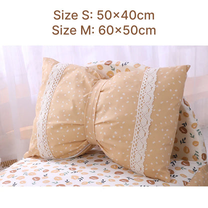 Cosy bow-accented pet bed with a detachable cushion, providing a luxurious and stylish sleeping retreat for small to medium-sized dogs and cats.