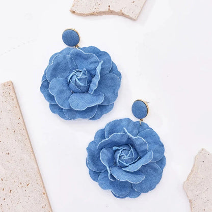 Exquisite denim drop earrings with charming accents, perfect for elevating British fashion and style