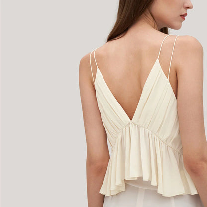 Elegant and refined silk camisole with V-neck design and delicate spaghetti straps, perfect for the modern British fashion enthusiast