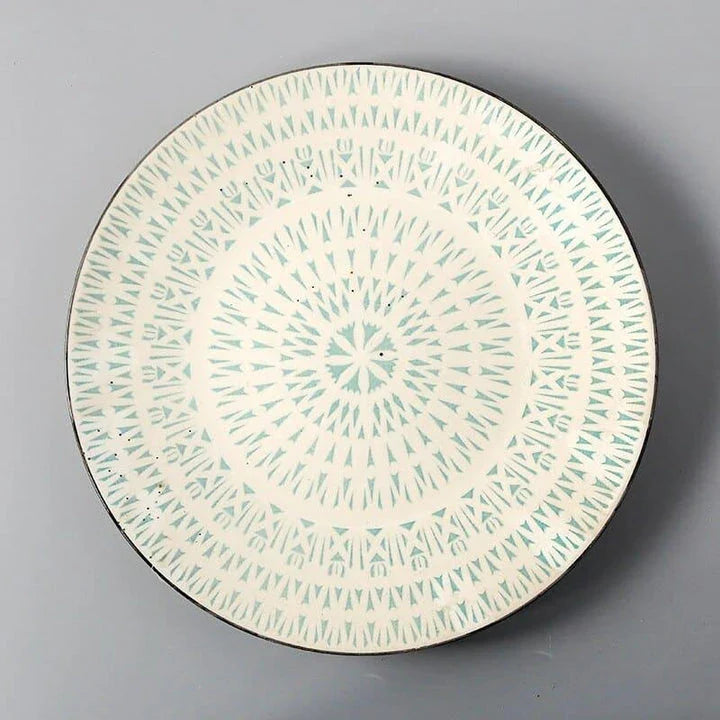 Elegant ceramic plates with vibrant, whimsical prints in a variety of enchanting designs