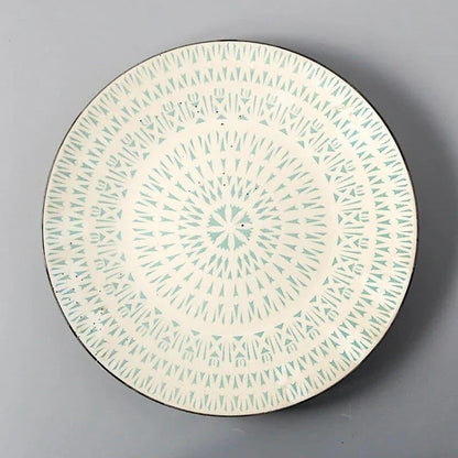 Elegant ceramic plates with vibrant, whimsical prints in a variety of enchanting designs