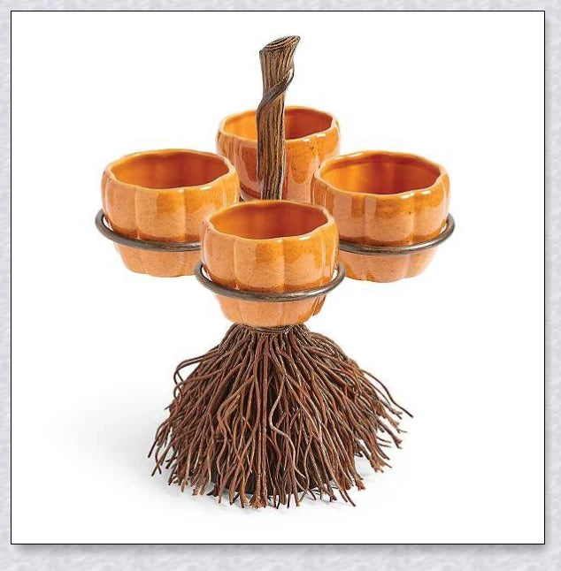 Pumpkin-shaped snack bowls on a broom-inspired stand, perfect for Halloween parties and displays