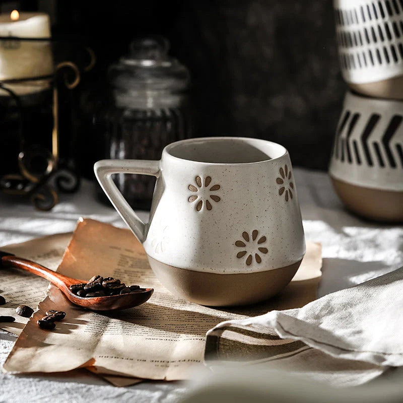 A hand-painted ceramic mug featuring a unique Nordic-inspired design, perfect for enjoying coffee, tea, or other beverages
