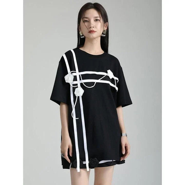A stylish black and white floral half-sleeve casual t-shirt with a classic round neckline, perfect for everyday wear.