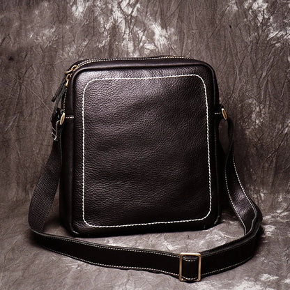 A premium cowhide leather satchel bag with a single shoulder strap, designed for the discerning British gentleman